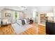 Bedroom with hardwood floors, vaulted ceilings, and two windows at 4720 Cedarfield Dr, Raleigh, NC 27606