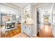 Inviting entryway showcasing an ornate cabinet nook, hardwood flooring, and an inviting ambiance at 4720 Cedarfield Dr, Raleigh, NC 27606