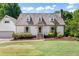 Inviting home with a well-manicured lawn and brick-lined garden bed at 4720 Cedarfield Dr, Raleigh, NC 27606