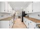 Bright kitchen features granite countertops, stainless steel appliances, and lots of cabinet space at 4720 Cedarfield Dr, Raleigh, NC 27606