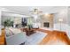 Cozy living room featuring a stone fireplace, wood floors, and neutral decor at 4720 Cedarfield Dr, Raleigh, NC 27606