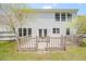 Home's rear exterior featuring a cozy deck and charming French doors for seamless indoor-outdoor flow at 4805 Castle Crest Ct, Raleigh, NC 27616