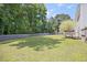 Expansive backyard perfect for outdoor activities, complemented by a home with a deck and privacy fence at 4805 Castle Crest Ct, Raleigh, NC 27616