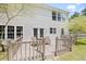 Home's rear exterior featuring a cozy deck and charming French doors for seamless indoor-outdoor flow at 4805 Castle Crest Ct, Raleigh, NC 27616