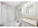 Well-lit bathroom with a shower-tub combo, a functional vanity, and a medicine cabinet at 4805 Castle Crest Ct, Raleigh, NC 27616