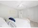 A bright bedroom offers comfort and relaxation with soft carpet and a ceiling fan at 4805 Castle Crest Ct, Raleigh, NC 27616