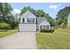 Charming two-story home featuring a two-car garage, well-manicured lawn, and inviting curb appeal at 4805 Castle Crest Ct, Raleigh, NC 27616