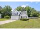 Charming two-story home featuring a two-car garage, well-manicured lawn, and inviting curb appeal at 4805 Castle Crest Ct, Raleigh, NC 27616