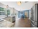 Bright kitchen featuring stainless steel appliances, white cabinetry, and access to the outdoor patio at 4805 Castle Crest Ct, Raleigh, NC 27616
