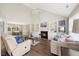 Inviting living room boasting a cozy fireplace, built-in shelving, vaulted ceilings, and hardwood floors at 4805 Castle Crest Ct, Raleigh, NC 27616