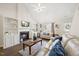 Bright living room showcasing vaulted ceilings, a fireplace, built-in shelves, and lots of seating at 4805 Castle Crest Ct, Raleigh, NC 27616