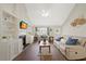 Comfortable living room featuring vaulted ceilings, a fireplace, built-ins, and ample natural light at 4805 Castle Crest Ct, Raleigh, NC 27616