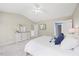 Cozy main bedroom featuring soft carpet, a comfortable bed, and an en-suite bathroom at 4805 Castle Crest Ct, Raleigh, NC 27616
