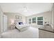 Spacious main bedroom with tray ceiling, large windows, and natural light at 4805 Castle Crest Ct, Raleigh, NC 27616