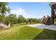 Backyard view showing green trees and a playset at 525 Marion Hills Way, Knightdale, NC 27545