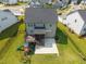 Aerial view of a backyard featuring a deck, patio, fenced in yard, and playground at 525 Marion Hills Way, Knightdale, NC 27545