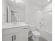 Clean bathroom featuring a single sink vanity, toilet, and bathtub-shower combination, all in a neutral color palette at 525 Marion Hills Way, Knightdale, NC 27545