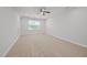 A bright, carpeted bedroom features a ceiling fan and a window at 525 Marion Hills Way, Knightdale, NC 27545