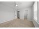 Spacious bedroom with carpet, a ceiling fan, and access to the ensuite bath and walk-in closet at 525 Marion Hills Way, Knightdale, NC 27545