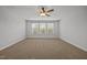 Expansive bedroom featuring large windows that flood the space with natural light at 525 Marion Hills Way, Knightdale, NC 27545