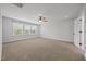 Spacious bedroom with ample natural light from large windows and ceiling fan at 525 Marion Hills Way, Knightdale, NC 27545