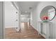 Bright, spacious foyer with hardwood floors, white trim, and access to multiple rooms, creating an inviting entrance at 525 Marion Hills Way, Knightdale, NC 27545