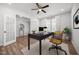 Well-lit office space with french doors, ceiling fan, and a comfortable chair at 525 Marion Hills Way, Knightdale, NC 27545