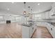 Open floor plan showcasing the kitchen island and the spacious living area at 525 Marion Hills Way, Knightdale, NC 27545