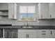 Modern kitchen with stainless steel dishwasher and granite countertops at 525 Marion Hills Way, Knightdale, NC 27545