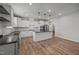 Bright kitchen featuring white cabinets, a center island, and stainless steel appliances at 525 Marion Hills Way, Knightdale, NC 27545