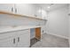 Bright laundry room featuring white cabinets, countertop, a sink, and tile flooring at 525 Marion Hills Way, Knightdale, NC 27545