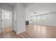 Bright living room featuring wood floors, a fireplace, ceiling fan, and many windows at 525 Marion Hills Way, Knightdale, NC 27545