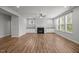 Spacious living room featuring hardwood floors, fireplace, and many windows at 525 Marion Hills Way, Knightdale, NC 27545