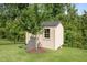 An attractive outbuilding for your storage needs, located in a backyard with green grass at 525 Marion Hills Way, Knightdale, NC 27545