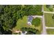 Expansive green lawn surrounds this home; enjoy the privacy provided by the mature trees at 5413 Lower Creek Ct, Apex, NC 27539
