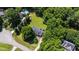 Aerial view of the home with surrounding trees and expansive, well-manicured backyard at 5413 Lower Creek Ct, Apex, NC 27539