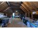 Spacious unfinished attic with exposed rafters, insulation, and flooring provides potential for storage or finishing at 5413 Lower Creek Ct, Apex, NC 27539