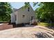 Home exterior featuring a patio area, well-maintained lawn, and white railing at 5413 Lower Creek Ct, Apex, NC 27539