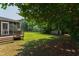 Large backyard with deck, shed, and lush green lawn, offering ample space for outdoor activities and enjoyment at 5413 Lower Creek Ct, Apex, NC 27539