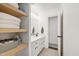 Bathroom featuring neutral paint, a large vanity, and open shelving for optimal storage at 5413 Lower Creek Ct, Apex, NC 27539