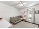 Bright bedroom with a daybed, neutral rug, and a view of the outside at 5413 Lower Creek Ct, Apex, NC 27539