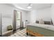 Cozy bedroom with a large window, neutral decor, and hardwood floors at 5413 Lower Creek Ct, Apex, NC 27539