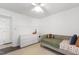 Bright bedroom with a daybed, white dresser, and dark wood floors at 5413 Lower Creek Ct, Apex, NC 27539