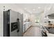 Well-lit kitchen features white cabinets, modern appliances, and ample counter space at 5413 Lower Creek Ct, Apex, NC 27539