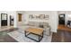 Bright living room with a comfortable sofa, stylish decor, and wood floors at 5413 Lower Creek Ct, Apex, NC 27539