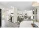 Spacious living area seamlessly connects the kitchen and dining space with modern decor at 5413 Lower Creek Ct, Apex, NC 27539