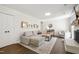 Bright living room with shiplap walls, fireplace, neutral furniture, and decorative rug at 5413 Lower Creek Ct, Apex, NC 27539
