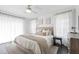 Stylish main bedroom featuring a neutral palette, a ceiling fan, and a comfy bed at 5413 Lower Creek Ct, Apex, NC 27539