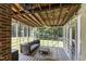 Relaxing screened porch with swing seat, ceiling fan, string lights, and view of the backyard at 5413 Lower Creek Ct, Apex, NC 27539