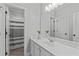 Neutral bathroom with a single sink vanity, mirror, and a shower at 6004 Brass Tack Ct, Fuquay Varina, NC 27526